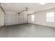 Spacious two-car garage with overhead door and natural light at 1653 Turtle Rock Dr, Lakeland, FL 33803