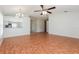 Bright, open-concept living room features wood floors and a ceiling fan at 1653 Turtle Rock Dr, Lakeland, FL 33803