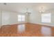 Spacious living room features wood floors, ceiling fan and natural light at 1653 Turtle Rock Dr, Lakeland, FL 33803