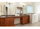 Elegant bathroom featuring granite countertops, dual sinks, walk in tub, and plenty of vanity storage at 18920 Overton St, Orlando, FL 32833