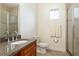 Bathroom showcases a glass door shower, granite countertop, and modern fixtures at 18920 Overton St, Orlando, FL 32833