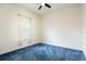 Cozy bedroom featuring plush carpet and natural light from the window at 18920 Overton St, Orlando, FL 32833