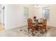 Bright dining area featuring a glass table, seating for four, and abundant natural light at 18920 Overton St, Orlando, FL 32833