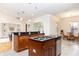 Open kitchen featuring granite countertops, stainless steel appliances, and a breakfast bar overlooking the dining area at 18920 Overton St, Orlando, FL 32833