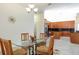 Eat-in kitchen featuring tile floor, granite counters, stainless appliances, and natural light at 18920 Overton St, Orlando, FL 32833