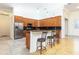 Spacious kitchen featuring stainless steel appliances, granite counters, and a breakfast bar with pendant lighting at 18920 Overton St, Orlando, FL 32833