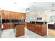 Well-equipped kitchen featuring granite counters, wood cabinets, and stainless steel appliances at 18920 Overton St, Orlando, FL 32833