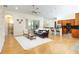 Well-lit living room with hardwood floors, comfortable seating, and an open layout to the kitchen at 18920 Overton St, Orlando, FL 32833