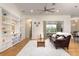 Spacious living room with hardwood flooring, built-in shelves, and sliding glass doors at 18920 Overton St, Orlando, FL 32833