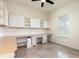 Spacious home office with custom cabinets, ample desk space, and tiled floors at 18920 Overton St, Orlando, FL 32833
