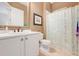 Bright bathroom features a large mirror, white cabinets, and a patterned shower curtain at 196 Torino Ln, Kissimmee, FL 34759