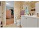 Bathroom view into an office with a Murphy bed and desk at 196 Torino Ln, Kissimmee, FL 34759