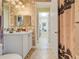 Bathroom view with decorative wallpaper and shower with decorative shower curtain at 196 Torino Ln, Kissimmee, FL 34759