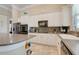Bright kitchen with white cabinets, stainless appliances, and granite countertops provides ample counter space at 196 Torino Ln, Kissimmee, FL 34759