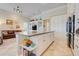 Large island offers storage, countertop space and decorative shelving in this open concept kitchen at 196 Torino Ln, Kissimmee, FL 34759