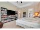 The main bedroom has two book shelves, a wall mounted tv, and access to the bathroom at 196 Torino Ln, Kissimmee, FL 34759