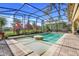 Screened in pool and patio, surrounded by lush landscaping at 196 Torino Ln, Kissimmee, FL 34759
