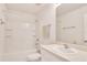 Bright white bathroom with a shower-tub combination, vanity, and soft lighting at 2029 Crystal Bell St, Orlando, FL 32824