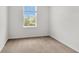 Empty bedroom with neutral carpeting, a sunny window, and clean, freshly painted walls at 2029 Crystal Bell St, Orlando, FL 32824