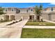 Inviting townhouse facade with attached garages and neatly landscaped front yard at 2029 Crystal Bell St, Orlando, FL 32824
