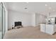 Bright living room features an open layout, sliding glass door access, and flows into kitchen area at 2029 Crystal Bell St, Orlando, FL 32824