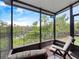 Back porch with comfortable chairs and beautiful lake view at 2112 Rookery Ln, Sanford, FL 32773