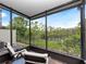 Relaxing screened lanai with lake view at 2112 Rookery Ln, Sanford, FL 32773