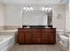 Bathroom featuring double sinks, granite countertop, and tiled floors, providing a functional and stylish space at 2112 Rookery Ln, Sanford, FL 32773
