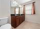 Bathroom features a double sink vanity and a toilet, offering a functional and practical space at 2112 Rookery Ln, Sanford, FL 32773