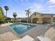 Community pool with lounge chairs and cabana area at 2112 Rookery Ln, Sanford, FL 32773