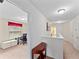 Upstairs hallway with art decorations and a bedroom at 2112 Rookery Ln, Sanford, FL 32773