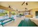 Community pool area featuring covered pavilion, picnic tables, and ceiling fans for residents' enjoyment at 2112 Rookery Ln, Sanford, FL 32773