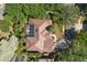 Overhead aerial view of home showing pool and dark roof at 2241 Lake Vilma Dr, Orlando, FL 32835