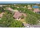 Expansive aerial view of the home's landscaped property and brown tile roof at 2241 Lake Vilma Dr, Orlando, FL 32835