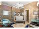 Luxurious bathroom with a soaking tub, a walk in shower and dual glass sinks at 2241 Lake Vilma Dr, Orlando, FL 32835
