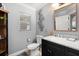 Well-appointed half bath featuring marble countertop vanity and decorative mirror at 2241 Lake Vilma Dr, Orlando, FL 32835
