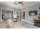 Bedroom showcasing a closet, door to the exterior, and a fun airplane ceiling fan at 2241 Lake Vilma Dr, Orlando, FL 32835