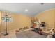 Bonus room or possible 5th bedroom featuring workout equipment and plenty of open space at 2241 Lake Vilma Dr, Orlando, FL 32835