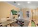 Multi-purpose bonus room featuring a desk, exercise equipment, and door to a possible fifth bedroom at 2241 Lake Vilma Dr, Orlando, FL 32835