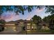 Beautiful home with a tile roof, lush landscaping, and a welcoming entrance at 2241 Lake Vilma Dr, Orlando, FL 32835