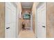 Bright hallway featuring a wall-mounted TV and neutral decor at 2241 Lake Vilma Dr, Orlando, FL 32835