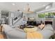 Cozy living room features neutral decor, a ceiling fan, and a staircase at 2241 Lake Vilma Dr, Orlando, FL 32835
