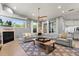 Large living room with a fireplace, neutral colors, and a comfortable sectional sofa at 2241 Lake Vilma Dr, Orlando, FL 32835