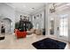 Bright living room with tall ceilings, tile floors, and stylish furnishings at 2241 Lake Vilma Dr, Orlando, FL 32835