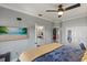 Large bedroom showcasing a ceiling fan, walk-in closet, and a tv mounted on the wall at 2241 Lake Vilma Dr, Orlando, FL 32835