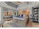 Bright main bedroom with a large bed and a decorative ceiling fan at 2241 Lake Vilma Dr, Orlando, FL 32835