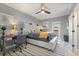 Comfortable bedroom featuring a ceiling fan, desk space, and a sliding glass door to the outside at 2241 Lake Vilma Dr, Orlando, FL 32835