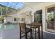 Outdoor dining area on the patio of the pool with views of the screened pool area at 2241 Lake Vilma Dr, Orlando, FL 32835
