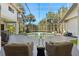Stunning screened pool with seating area for entertaining and enjoying outdoor living at 2241 Lake Vilma Dr, Orlando, FL 32835