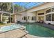 Sparkling pool and spa in screened enclosure offer a private backyard retreat at 2241 Lake Vilma Dr, Orlando, FL 32835